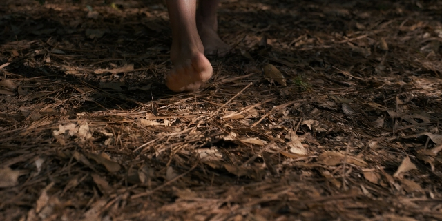 Wide shot frame from Stranger Things — walking, bed, person