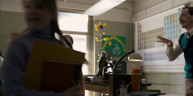 Wide shot frame from Stranger Things — standing, hand, shirt