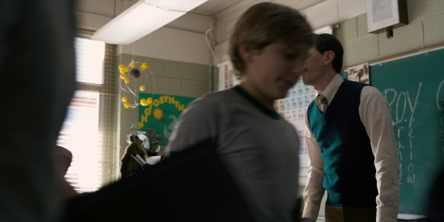 Wide shot frame from Stranger Things — standing, room, dialogue