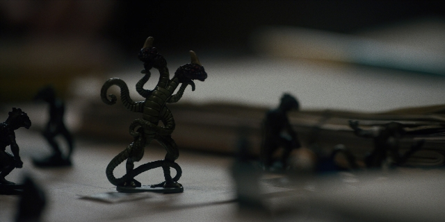 Frame from Stranger Things — standing, table, animal