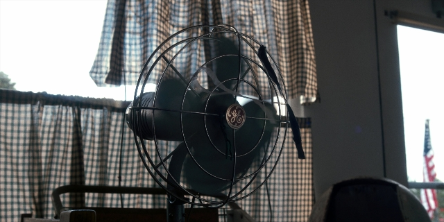 Wide shot frame from Stranger Things — room, curtain, window