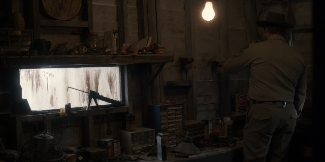 Wide shot frame from Stranger Things — standing, hat, uniform