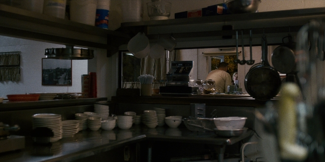Frame from Stranger Things — standing, table, kitchen
