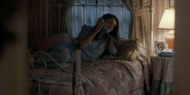 Wide shot frame from Stranger Things — room, table, dialogue