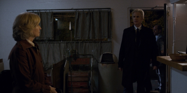 Wide shot frame from Stranger Things — sitting, standing, room
