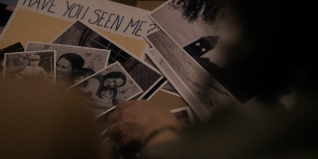 Wide shot frame from Stranger Things — room, hand, person