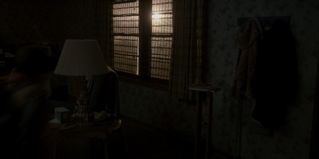 Wide shot frame from Stranger Things — book, room, table