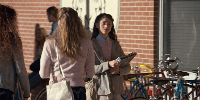 Wide shot frame from Stranger Things — book, standing, walking