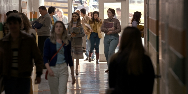 Wide shot frame from Stranger Things — walking, person, human face