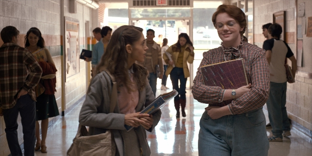Wide shot frame from Stranger Things — standing, walking, dialogue