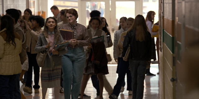 Wide shot frame from Stranger Things — action, group, walking