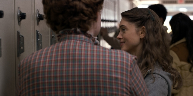 Wide shot frame from Stranger Things — standing, room, shirt