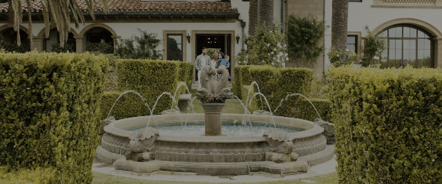 Wide shot frame from Fast & Furious 7 — standing, water, fountain