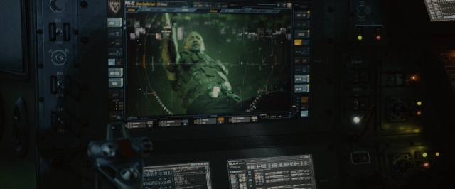 Wide shot frame from Fast & Furious 7 — uniform, face, airplane