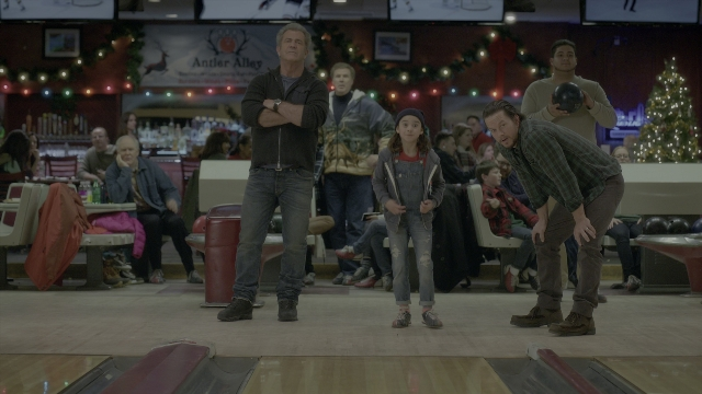 Wide shot frame from Daddy's Home 2 — sitting, standing, face