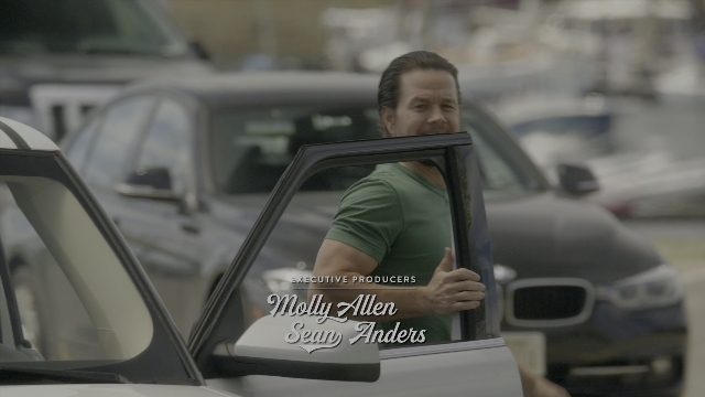 Wide shot frame from Daddy's Home 2 — sitting, car, shirt