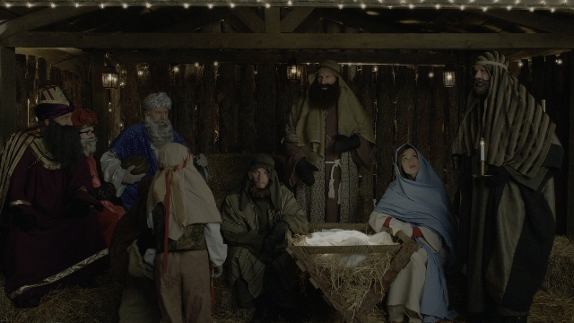 Wide shot frame from Daddy's Home 2 — sitting, standing, bed