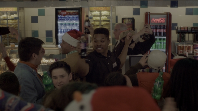 Wide shot frame from Daddy's Home 2 — standing, food, shirt