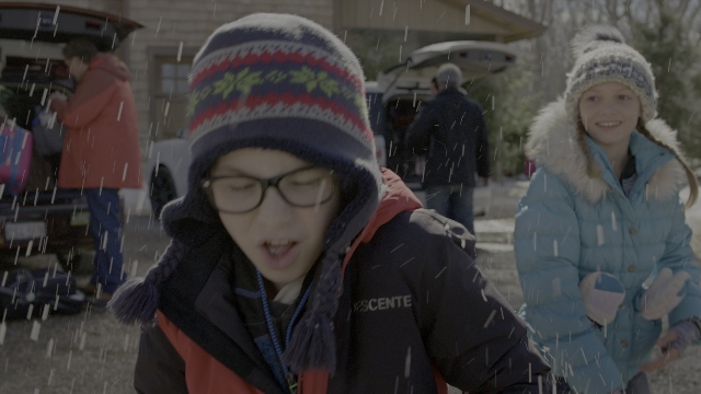 Medium shot frame from Daddy's Home 2 — standing, street, car