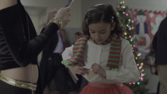 Frame from Daddy's Home 2 — standing, room, phone