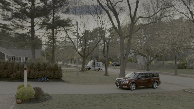 Wide shot frame from Daddy's Home 2 — street, car, house