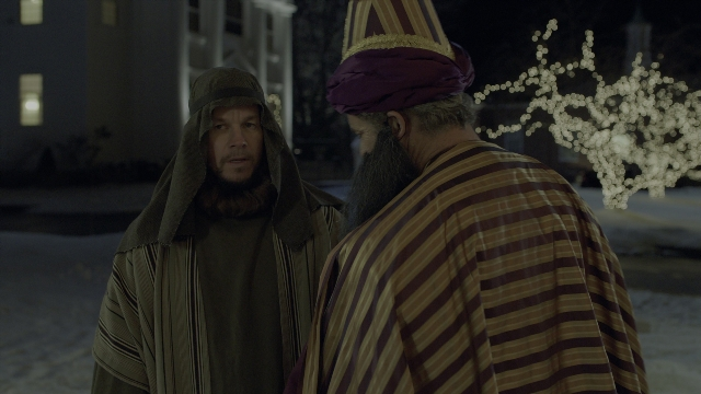 Wide shot frame from Daddy's Home 2 — standing, street, hat