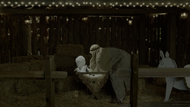 Wide shot frame from Daddy's Home 2 — sitting, bed, animal