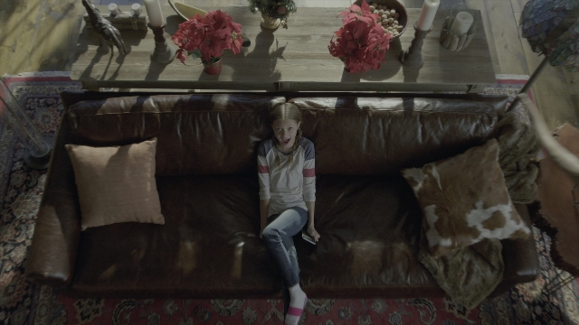 Wide shot frame from Daddy's Home 2 — sitting, room, table