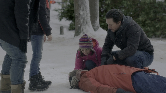 Wide shot frame from Daddy's Home 2 — standing, jacket, face