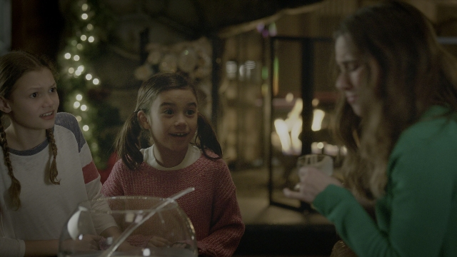 Wide shot frame from Daddy's Home 2 — sitting, room, table