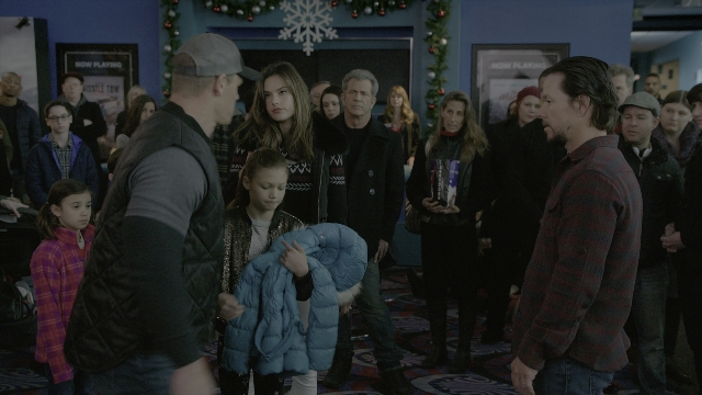 Wide shot frame from Daddy's Home 2 — standing, room, hat