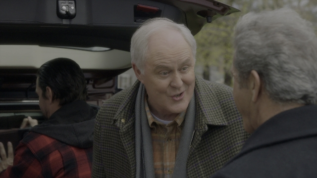 Medium shot frame from Daddy's Home 2 — standing, street, car