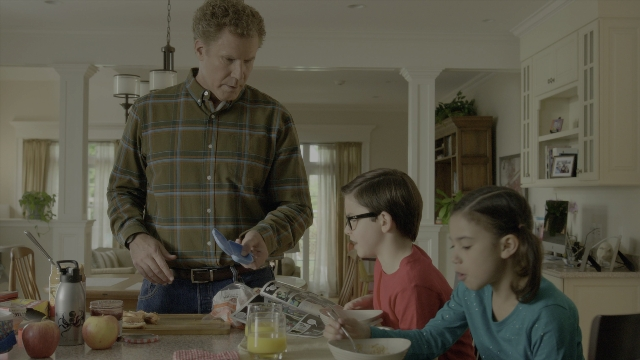 Wide shot frame from Daddy's Home 2 — standing, kitchen, food