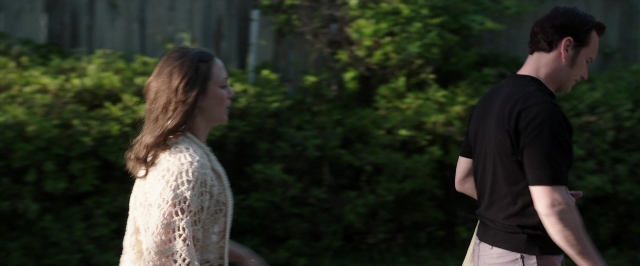Wide shot frame from The Conjuring — walking, dialogue, face