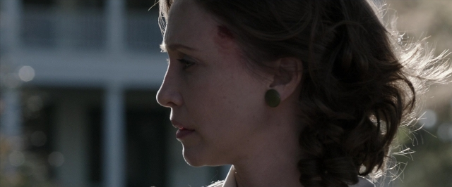 Frame from The Conjuring — face, hair, person