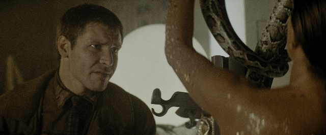 Medium shot frame from Blade Runner — room, tie, shirt
