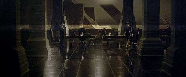 Wide shot frame from Blade Runner — sitting, standing, room