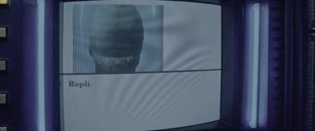 Wide shot frame from Blade Runner — face, hair, person