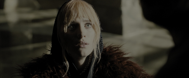 Medium shot frame from Blade Runner 2049 — coat, face, hair