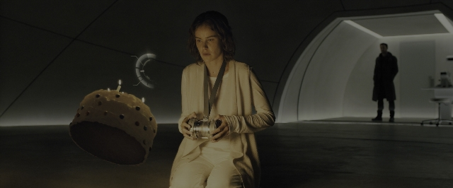 Wide shot frame from Blade Runner 2049 — sitting, standing, room
