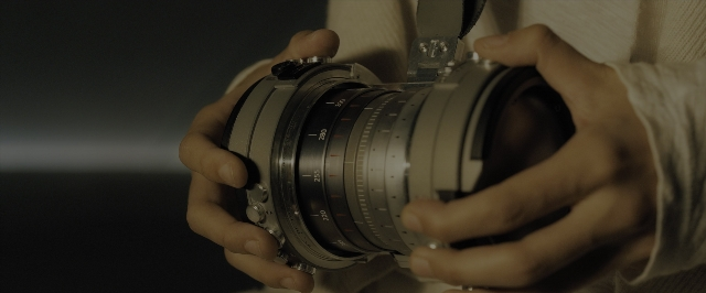Wide shot frame from Blade Runner 2049 — hand, camera, person