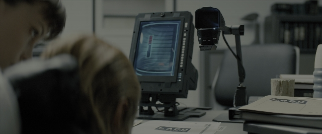 Wide shot frame from Blade Runner 2049 — sitting, office, water