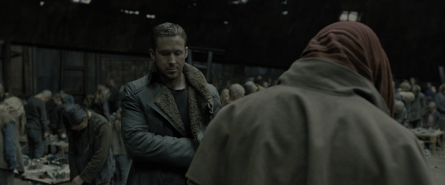 Wide shot frame from Blade Runner 2049 — standing, room, face