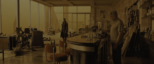 Wide shot frame from Blade Runner 2049 — standing, room, table