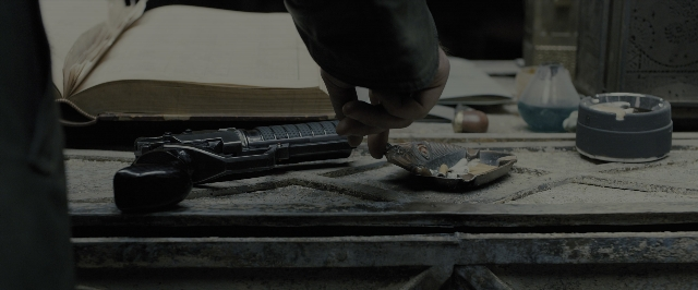 Frame from Blade Runner 2049 — book, room, table