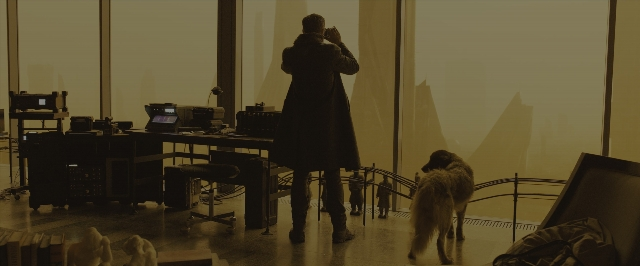 Wide shot frame from Blade Runner 2049 — standing, walking, room