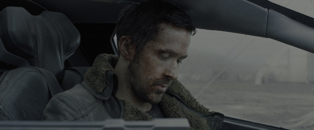 Wide shot frame from Blade Runner 2049 — sitting, street, car