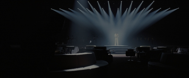 Wide shot frame from Blade Runner 2049 — standing, fountain, person