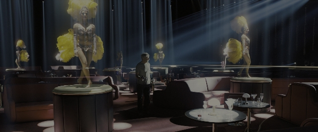 Wide shot frame from Blade Runner 2049 — standing, room, table
