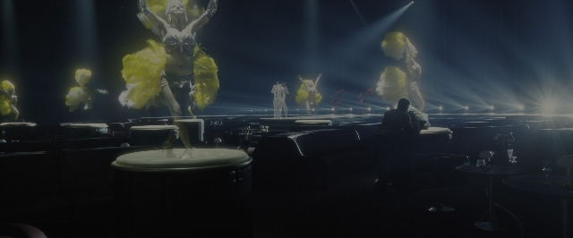 Medium shot frame from Blade Runner 2049 — sitting, person
